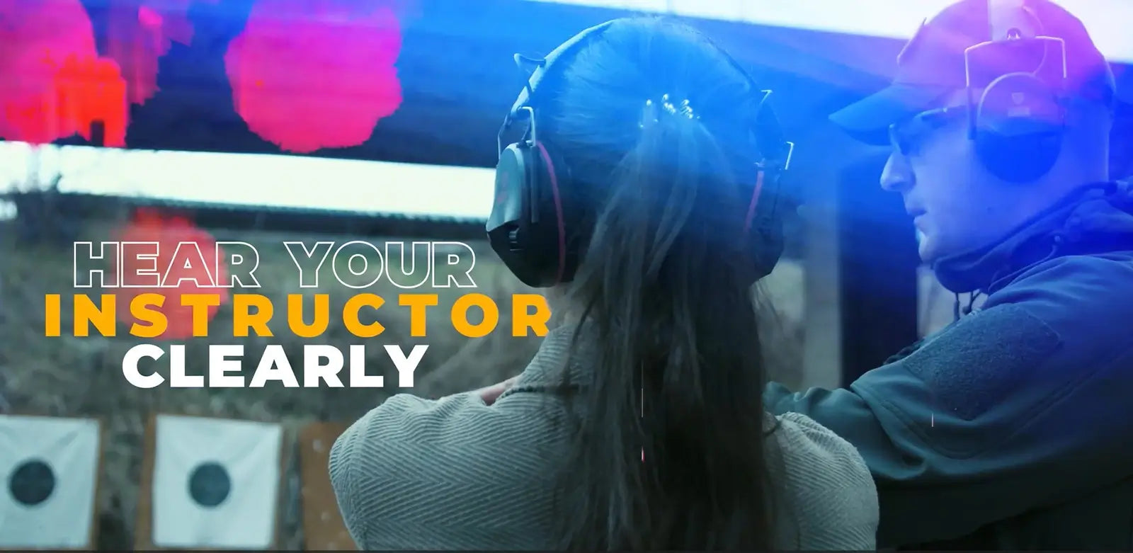 Instructor and student wearing TradeSmart Safety electronic earmuffs at a shooting range with the text 'Hear Your Instructor Clearly' displayed.